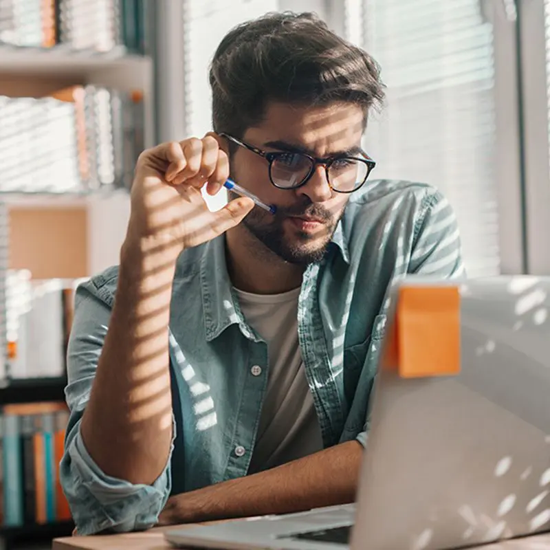 manager studying computer screen