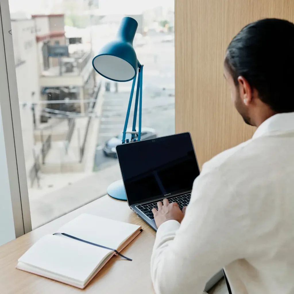 Man works with his laptop at a desk