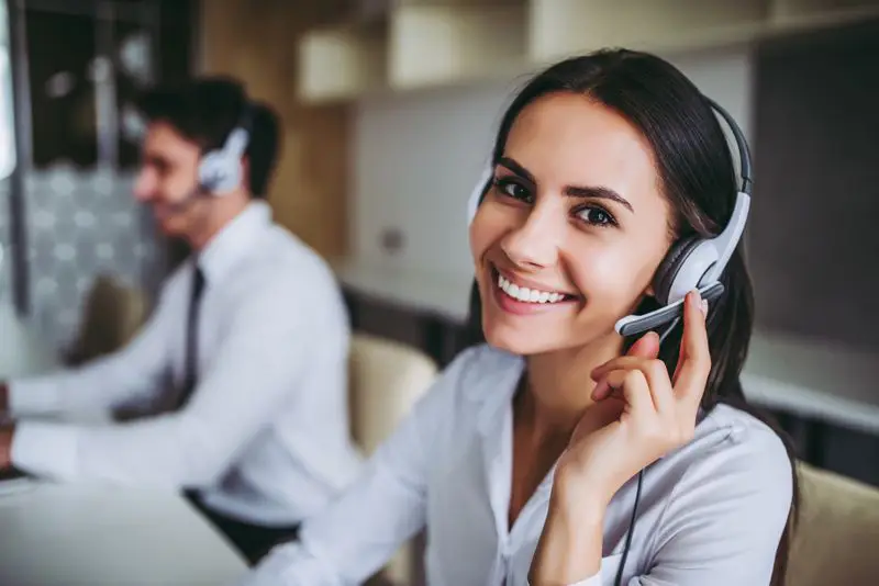 recruiter with headphones smiling